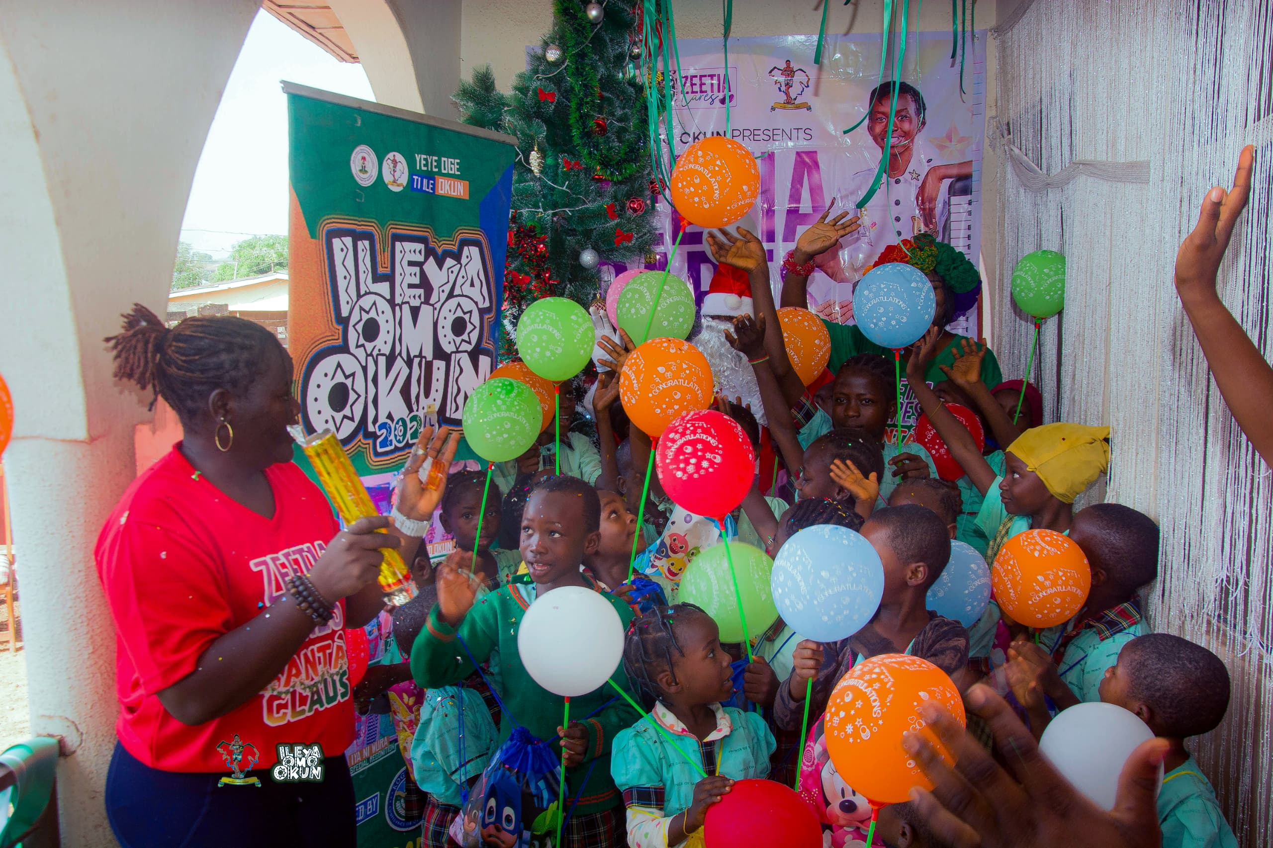 ILE YA OMO OKUN 2024 KICK STARTED WITH ZEETIA SANTA CLAUS (FATHER CHRISTMAS) AS CAMP OPEN'S IMMEDIATELY FOR THE NEXT 2 WEEKS TO THE GLORY OF GOD* This year annual event in Okunland known as *ILE'YA OMO OKUN*, kick started the 6th edition with ZEETIA CARES one of the most important segment of the event ever since inception. The ZEETIA CARES segment is born out of the passion and love to giving back to the society most importantly the primary and secondary students. Yeye Omoleye Adebanji Aiyelabowo,the Yeye Oge ti ile okun said the aim is to aid their education through provision of basic school needs. This time ZEETIA CARE edition came with a different phase to complement the December festive season. The season came with SANTA CLAUS(Father Christmas), a charitable moment that focus on children to support and hence their creativity, allowing children to experience the joy of fantasy, tradition and Culture. The ZEETIA CARE SANTA CLAUS EDITION(Father Christmas), leaves a remarkable moment with the over 150 primary pupils and secondary students from 10 different schools within okunland that participated yesterday 13th of December 2024 at kabba as it connect with cultural traditions and family customs. It also fosters a sense of belonging and continuity, linking generations through shared experiences, dances,gifts and stories. REPORTING @ *MEDIA AND PUBLICITY FOR ILE'YA OMO OKUN 2024